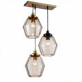 Suspension en verre transparent avec trois abat-jours hexagonaux en métal doré et noir 20 x 20 x 35cm